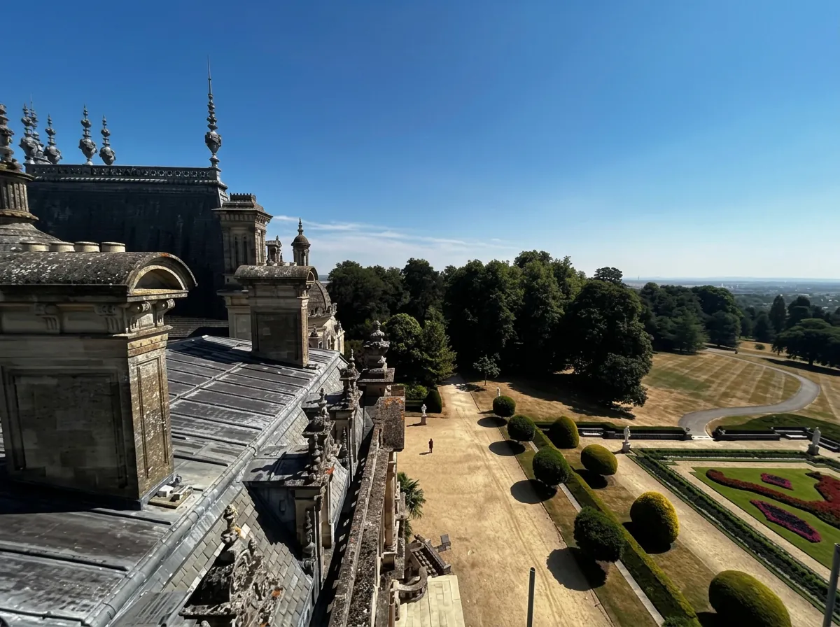 Restored lead roof with stone chimneys above formal gardens